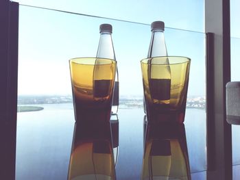 Close-up of beer in glass window