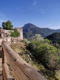 Scenic view of landscape against blue sky