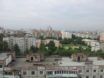 High angle view of buildings in city against sky