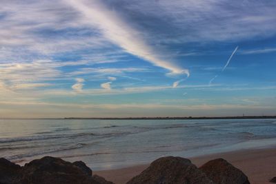 Scenic view of sea against cloudy sky