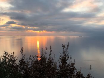 Scenic view of lake against sky during sunset