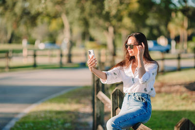 Young woman using mobile phone