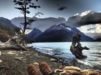 Scenic view of lake with mountains in background