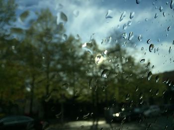 Close-up of wet glass window in rainy season