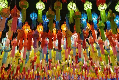 Low angle view of illuminated lanterns hanging in temple