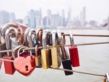 Close-up of padlocks on railing