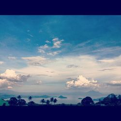 Scenic view of landscape against cloudy sky