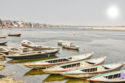 Boats moored on sea