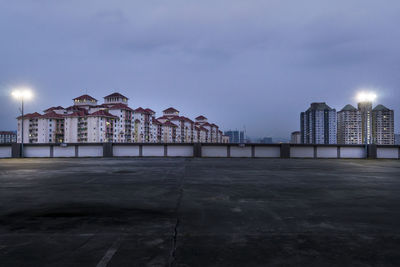 View of buildings against cloudy sky