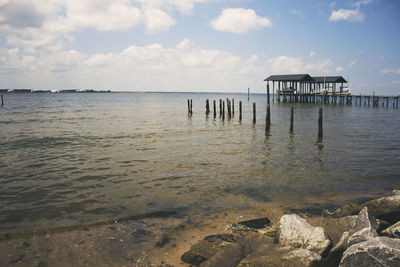 Scenic view of sea against cloudy sky