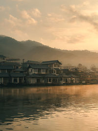 Scenic view of lake against sky during sunset