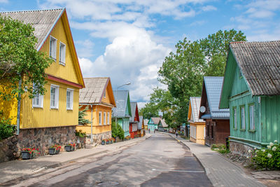 Old lithuanian traditional wooden houses with three windows in summer