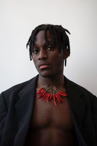 Black man wearing chili necklace portrait