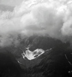 High angle view of land and sea against sky