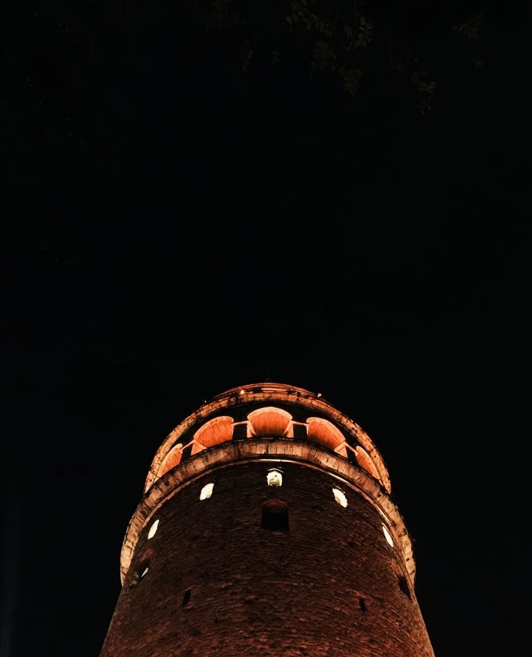 darkness, night, architecture, light, built structure, building exterior, history, no people, low angle view, the past, copy space, sky, travel destinations, reflection, nature, building, lighting, tower, brick
