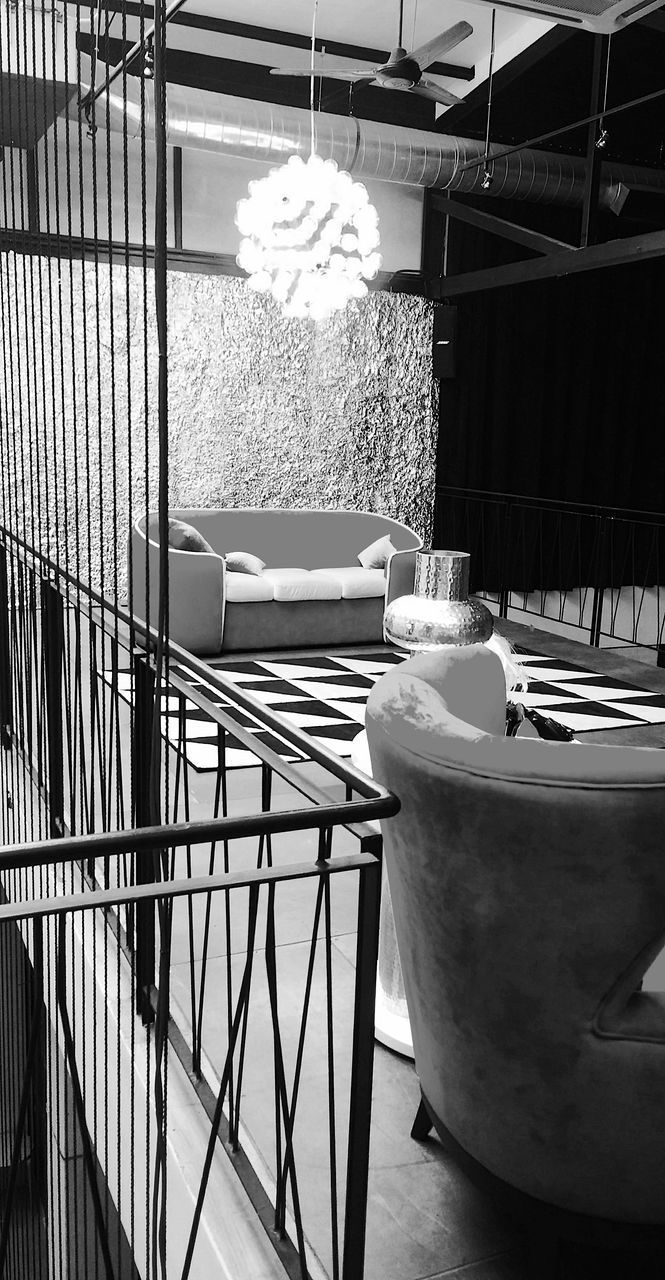 CLOSE-UP OF CHAIRS AND TABLE AT RESTAURANT