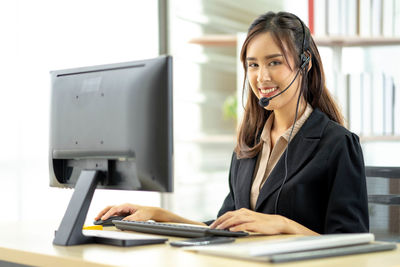 Young woman using mobile phone