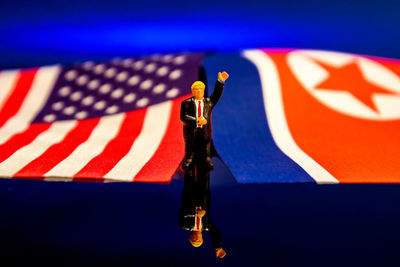 Close-up of flag against blue wall