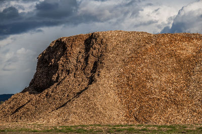 Low angle view of rock formations against sky