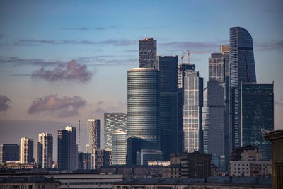 Modern buildings in city against sky