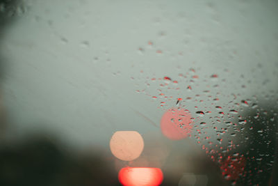 Close-up of raindrops on glass window