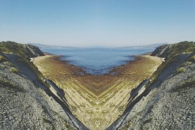 Scenic view of sea against blue sky