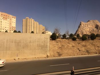 Man standing by built structure