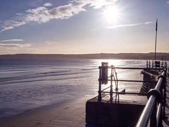 View over metal railings to the sandy beach at filey, north yorkshire, england, at low tide