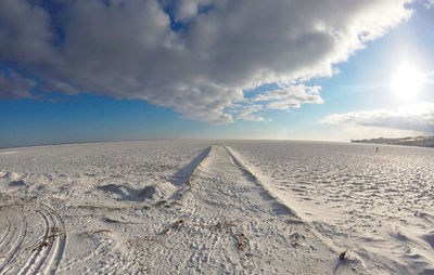 Winter landscape with frozen dunes, beach and sea in nida, lithuania, baltic sea