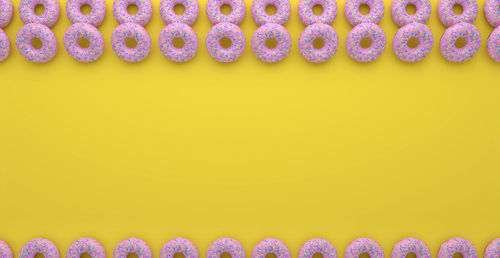 Close-up of multi colored pencils against wall