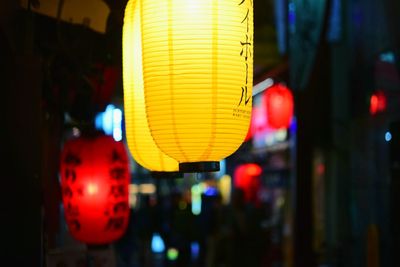 Close-up of illuminated lanterns hanging at night