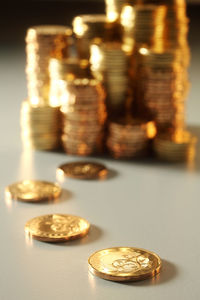 Close-up of stacked coins on table