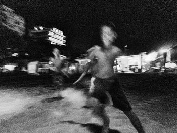 Shadow of person on street at night