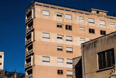 Low angle view of buildings against clear sky