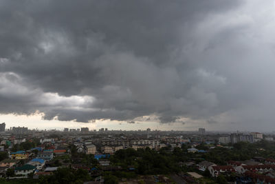 High angle view of townscape against cloudy sky