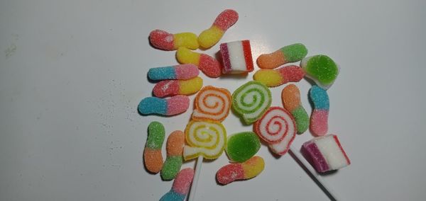 High angle view of multi colored candies on table