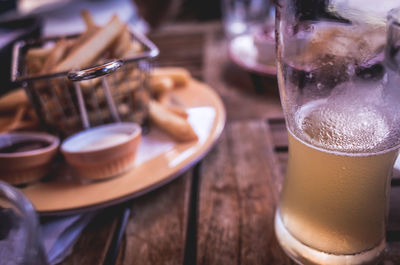 Close-up of beer glass on table