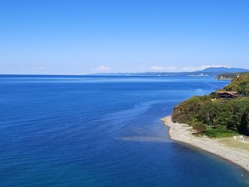 Scenic view of sea against blue sky