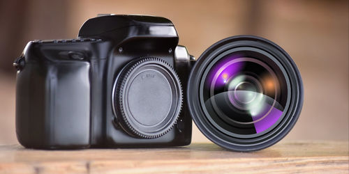 Close-up of camera on table