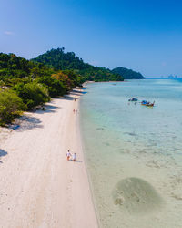 Scenic view of beach against clear sky