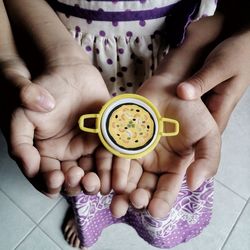 High angle view of woman hand holding drink