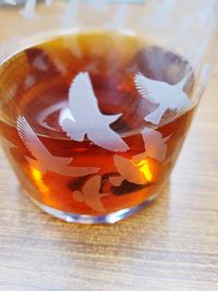 High angle view of coffee in glass on table