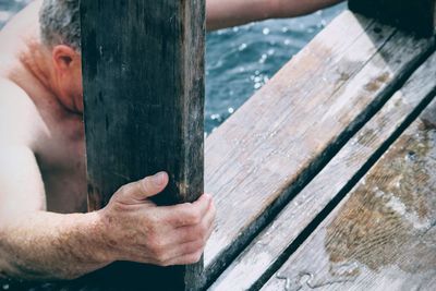 Close-up of man working on wood