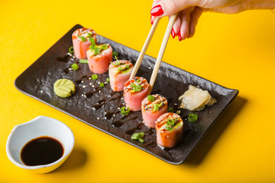 Cropped hand of person preparing food