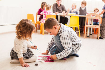 Students painting in classroom