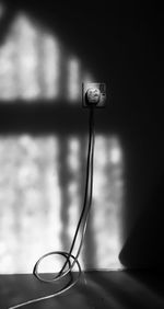 Close-up of electric lamp on table