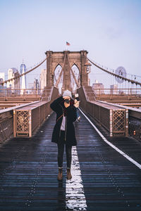 People standing on footbridge