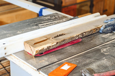 Cutting board with circular saw in carpentry workshop