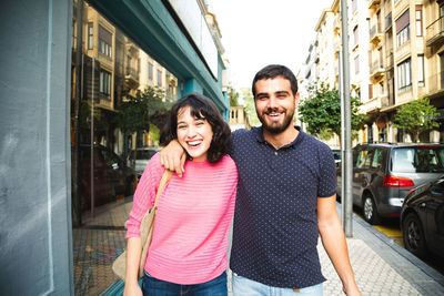 Portrait of a smiling young man in city