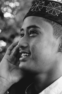 Close-up portrait of young man looking away